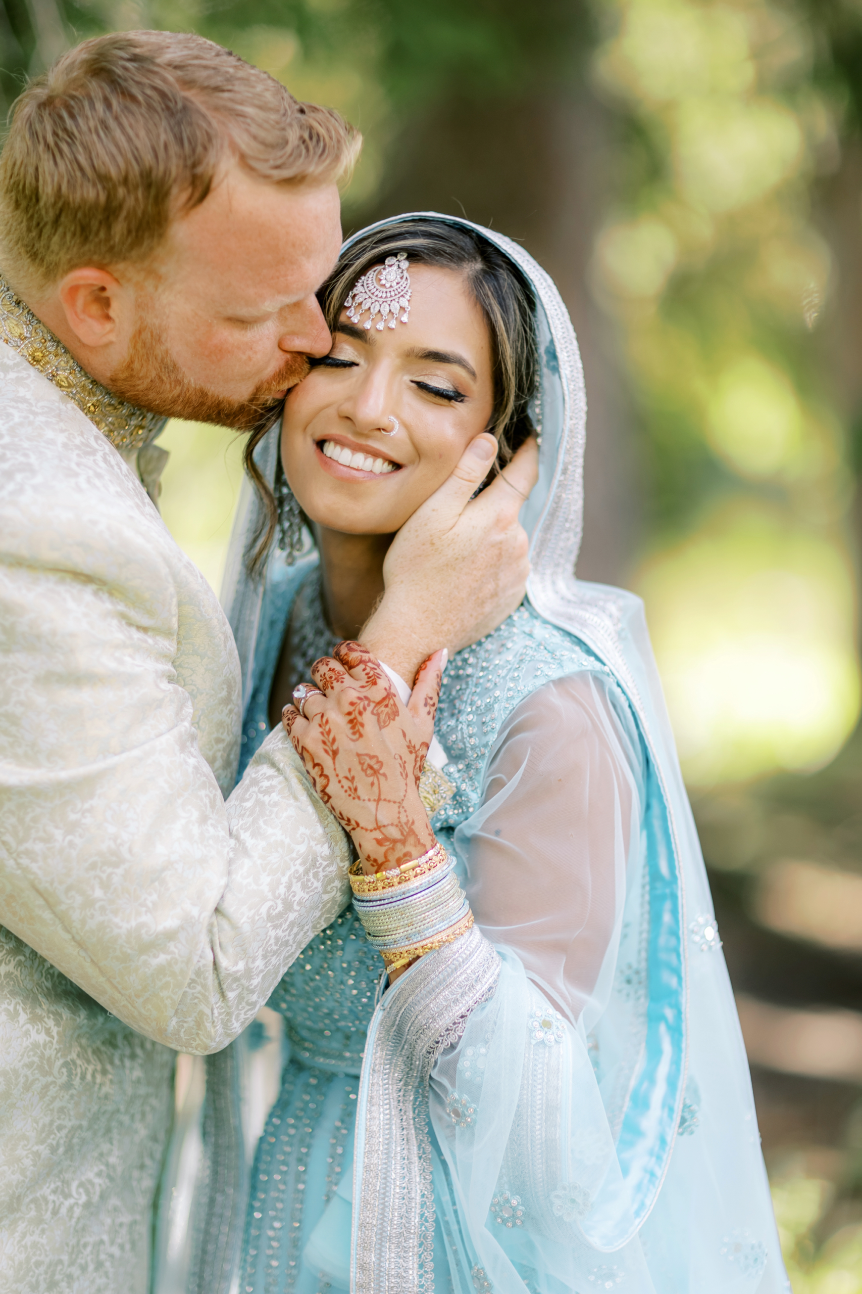 indian couple giving a kiss on the cheeks