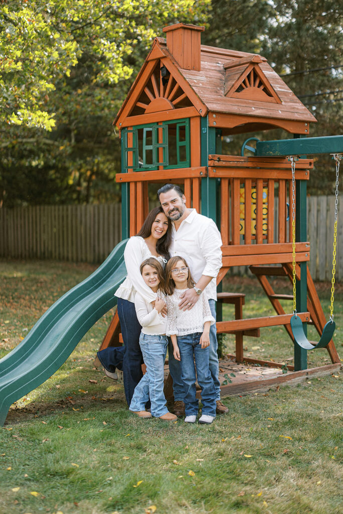 family at their backyard playground