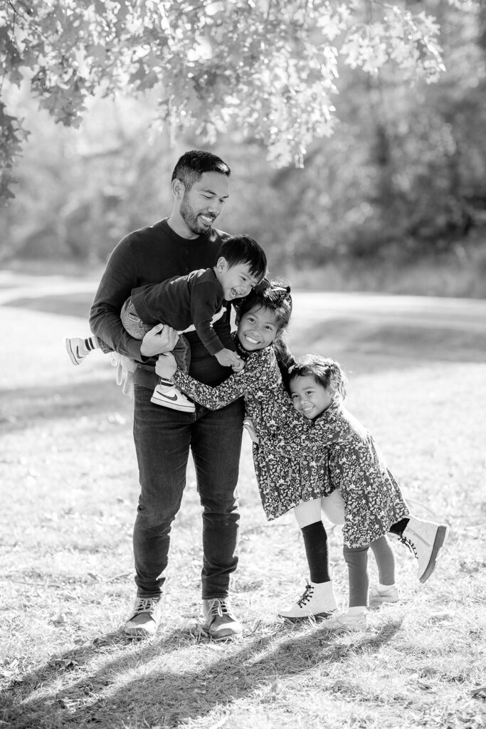 dad and his three kids at there park